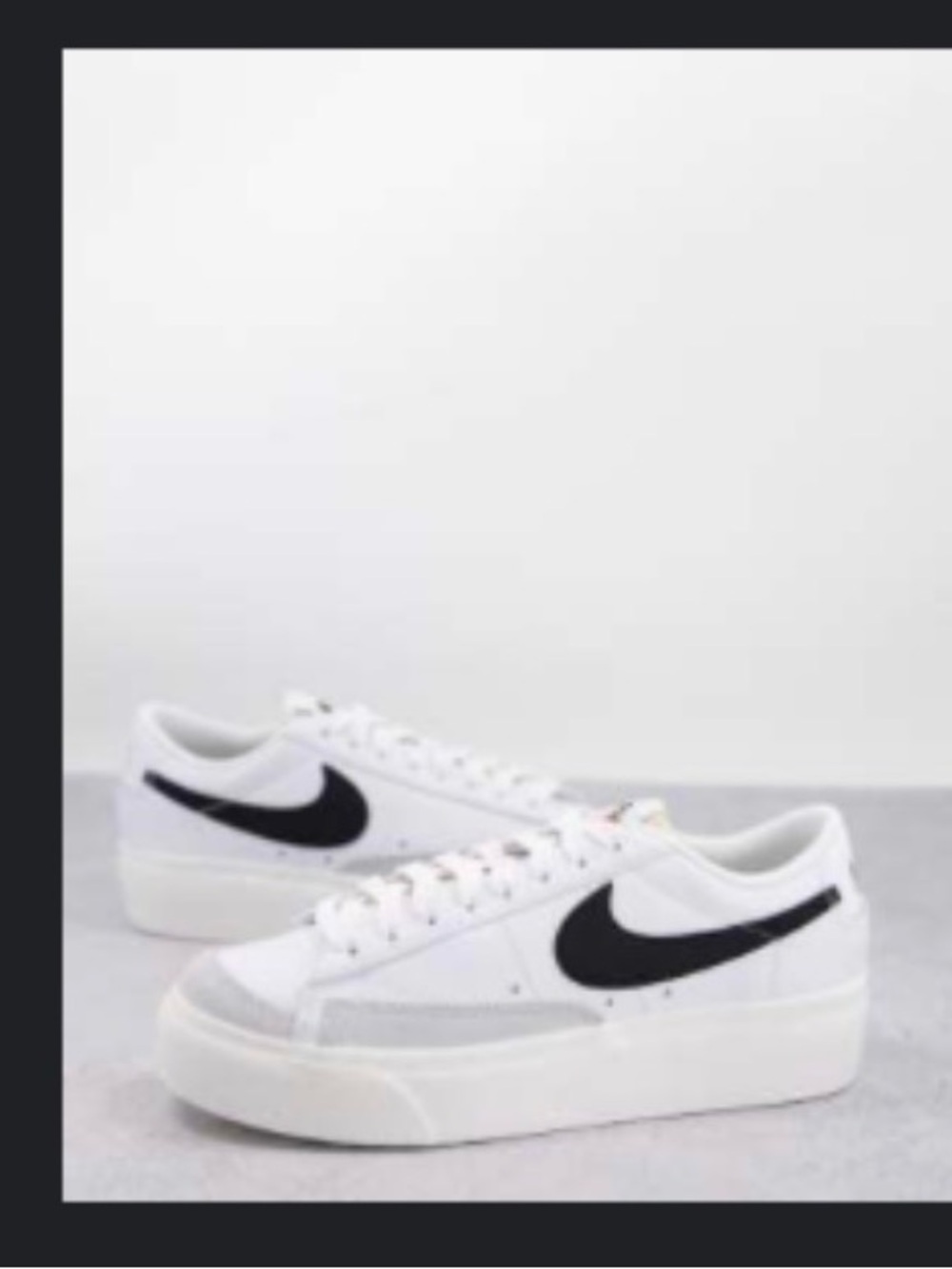 Nike Blazer Low Platform sneakers in white and black